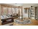 Bright living room with hardwood floors, decorative columns, and stylish furnishings at 404 Via Sonador, Henderson, NV 89012