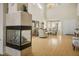Bright living room with a fireplace, stylish furniture, and high ceilings at 404 Via Sonador, Henderson, NV 89012