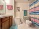 Cozy bathroom with a single sink vanity and colorful shower curtain at 4151 Sanderling Cir # 351, Las Vegas, NV 89103