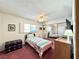Bright bedroom featuring a ceiling fan, closet and a window at 4151 Sanderling Cir # 351, Las Vegas, NV 89103