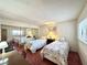Bright bedroom with mirrored closet doors and plush carpet at 4151 Sanderling Cir # 351, Las Vegas, NV 89103