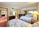 Comfortable bedroom featuring two beds, mirrored closet, and neutral color scheme at 4151 Sanderling Cir # 351, Las Vegas, NV 89103