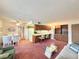 Open-concept living room and dining area with pink carpet at 4151 Sanderling Cir # 351, Las Vegas, NV 89103