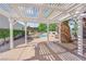 Inviting backyard patio with a pergola offering shade and a view of the sparkling swimming pool at 4418 Desert Bloom Ct, Las Vegas, NV 89129