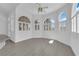 Bright and airy bonus room featuring arched windows, white walls, and hard surface floors at 4418 Desert Bloom Ct, Las Vegas, NV 89129