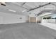 Spacious garage with built in cabinets and room for multiple vehicles at 4418 Desert Bloom Ct, Las Vegas, NV 89129