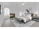 Luxurious bedroom with fireplace, accent wall, and ensuite bathroom with soaking tub at 4418 Desert Bloom Ct, Las Vegas, NV 89129