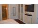 Bedroom with closet featuring sliding doors, a TV and a view of the bathroom at 4585 Dean Martin Dr # 205, Las Vegas, NV 89103