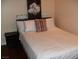 Bedroom featuring a white comforter, multiple pillows and a dark nightstand at 4585 Dean Martin Dr # 205, Las Vegas, NV 89103