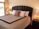 The bedroom features a unique headboard and a soft color palette for a serene atmosphere at 4585 Dean Martin Dr # 205, Las Vegas, NV 89103