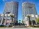 Two modern high-rise buildings with retail space are set against a blue sky at 4585 Dean Martin Dr # 205, Las Vegas, NV 89103