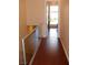 The hallway features hardwood floors, glass railing and leads to a bedroom at 4585 Dean Martin Dr # 205, Las Vegas, NV 89103