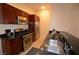 Kitchen area featuring granite counters, stainless steel appliances, wood cabinets, and a breakfast bar at 4585 Dean Martin Dr # 205, Las Vegas, NV 89103
