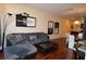 This living room has a comfortable gray sectional, hardwood floors, and a modern design at 4585 Dean Martin Dr # 205, Las Vegas, NV 89103
