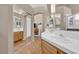 Bright bathroom with tile floors, double sinks, and mirrored closet doors for added space at 4628 Standing Bluff Way, Las Vegas, NV 89130