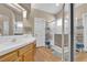 A spacious bathroom with double sinks, a large mirror, and a glass-enclosed shower at 4628 Standing Bluff Way, Las Vegas, NV 89130