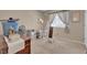 Bedroom with beige walls, a window, and cluttered furniture at 4628 Standing Bluff Way, Las Vegas, NV 89130