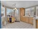 Sunny dining area featuring tile floors, natural light, and honey oak colored cabinets and furniture at 4628 Standing Bluff Way, Las Vegas, NV 89130