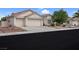 Charming single-story home featuring a two-car garage, desert landscaping, and a classic Southwestern style at 4628 Standing Bluff Way, Las Vegas, NV 89130