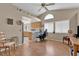 Cozy living space with wood floors, a vaulted ceiling, and an arch window for natural light at 4628 Standing Bluff Way, Las Vegas, NV 89130