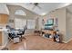 Cozy living space with wood floors, vaulted ceiling, arch window, and a view of the adjacent workspace at 4628 Standing Bluff Way, Las Vegas, NV 89130