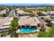 This aerial image shows the house with a backyard pool, nice landscaping and a covered patio at 4719 Riva De Romanza St, Las Vegas, NV 89135