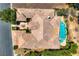 Overhead aerial showcasing house with mature landscaping, covered patio and pool at 4719 Riva De Romanza St, Las Vegas, NV 89135