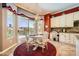 Cozy breakfast nook near the kitchen with views of the pool and a sliding glass door at 4719 Riva De Romanza St, Las Vegas, NV 89135