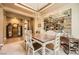 Inviting dining space with elegant display shelves and ample room for entertaining guests at 4719 Riva De Romanza St, Las Vegas, NV 89135