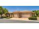 Attractive home featuring a well-maintained exterior, a gated entry, and a two-car garage at 4719 Riva De Romanza St, Las Vegas, NV 89135
