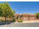 Charming home featuring a well-maintained exterior, a gated entry, and a two-car garage at 4719 Riva De Romanza St, Las Vegas, NV 89135
