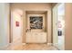 Inviting hallway with arched doorway, a decorative niche, and neutral colors at 4719 Riva De Romanza St, Las Vegas, NV 89135