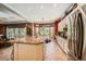 Spacious kitchen island provides seating and is ideal for cooking and gathering with friends at 4719 Riva De Romanza St, Las Vegas, NV 89135