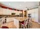 Well-appointed kitchen featuring a stone-clad island and plenty of cabinet space at 4719 Riva De Romanza St, Las Vegas, NV 89135