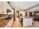 Modern kitchen with granite countertops, stainless steel appliances, and an open design at 4719 Riva De Romanza St, Las Vegas, NV 89135