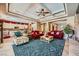 Expansive living room with abundant seating, beautiful coffered ceilings, and an open layout at 4719 Riva De Romanza St, Las Vegas, NV 89135