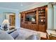 Welcoming living room with custom built-ins and a TV, perfect for relaxing and entertaining at 4719 Riva De Romanza St, Las Vegas, NV 89135