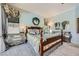 Comfortable bedroom featuring soft blue walls, wood furniture, and carpet floors at 4719 Riva De Romanza St, Las Vegas, NV 89135