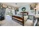 Serene bedroom with a decorative wreath, access to a private patio, and lots of natural light at 4719 Riva De Romanza St, Las Vegas, NV 89135