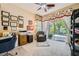 Comfortable home office with a desk, chair, and sliding glass doors to the backyard at 4719 Riva De Romanza St, Las Vegas, NV 89135