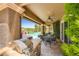 Covered patio with an outdoor kitchen, a dining area, and a beautiful view of the pool at 4719 Riva De Romanza St, Las Vegas, NV 89135