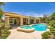 Stunning backyard oasis with a private pool, spa, and meticulously designed landscaping at 4719 Riva De Romanza St, Las Vegas, NV 89135
