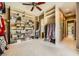 Spacious walk-in closet with extensive shelving and hanging space, perfect for organization at 4719 Riva De Romanza St, Las Vegas, NV 89135