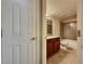 Bathroom view from entry featuring granite counters, tile flooring, and tiled tub-shower at 4943 Indian River Dr # 133, Las Vegas, NV 89103