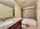 Bathroom featuring granite counters, vanity, toilet, and tiled tub-shower at 4943 Indian River Dr # 133, Las Vegas, NV 89103