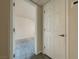 A bedroom entrance featuring neutral walls, plush gray carpeting and white trim at 4943 Indian River Dr # 133, Las Vegas, NV 89103