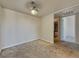 Bedroom with plush carpet, ample lighting, and doorway to the bathroom at 4943 Indian River Dr # 133, Las Vegas, NV 89103