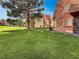 Well-maintained apartment building with a lush green lawn at 4943 Indian River Dr # 133, Las Vegas, NV 89103