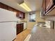 Functional kitchen with tile floors, white appliances, and ample cabinet space at 4943 Indian River Dr # 133, Las Vegas, NV 89103