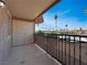 Outdoor patio features a privacy shade, views of mature trees and distant buildings at 4943 Indian River Dr # 133, Las Vegas, NV 89103
